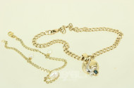 Gliederarmband, 585er GG, sowie 1 Anhänger, 585er GG, besetzt mit 1 Saphir u. 1 kl. Diamanten