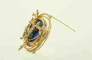 Fantasievolle Brosche mit rundem Lapislazuli-Stein