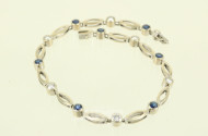 Gliederarmband, mit 7 kl. Saphiren und 6 kl. Brillanten von zus. ca. 0.60ct