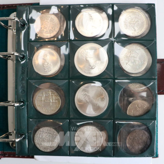 Münzalbum mit verschiedenen Silbermünzen