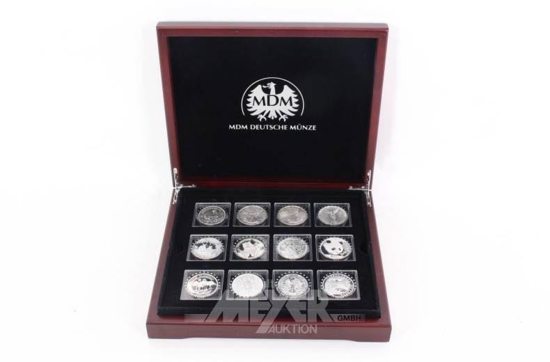 Konvolut 'Die 15 berühmtesten Silbermünzen der Welt' in Holzkassette