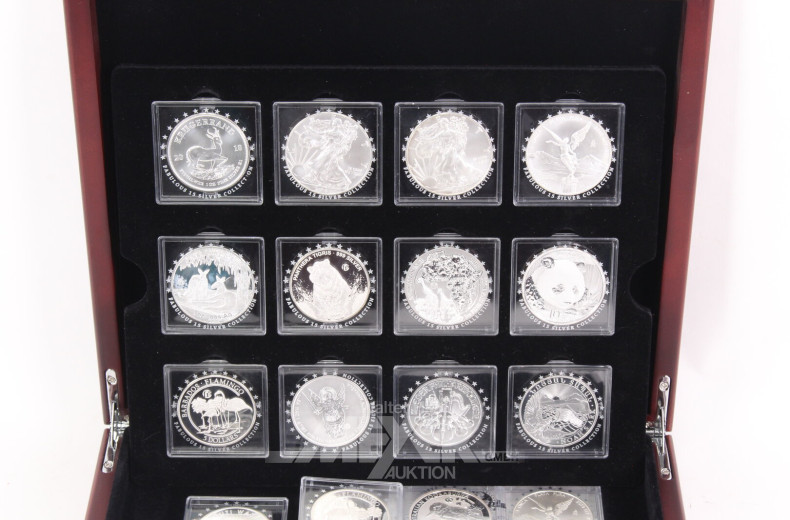 Konvolut 'Die 15 berühmtesten Silbermünzen der Welt' in Holzkassette