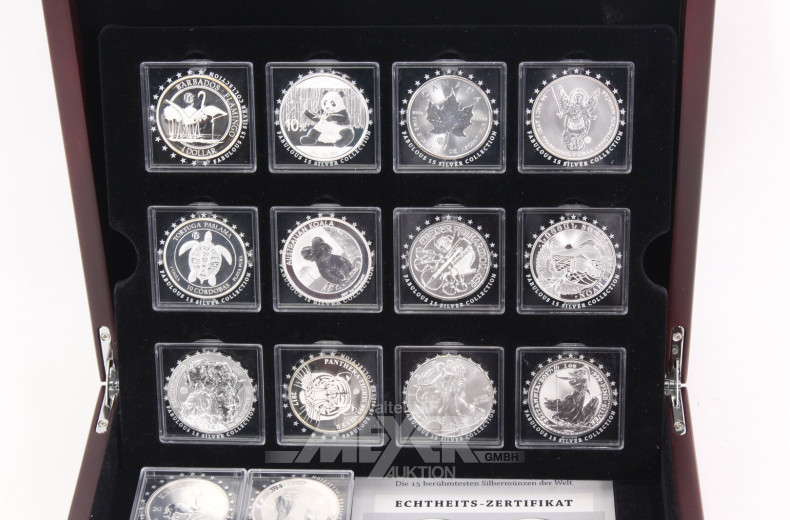 Konvolut 'Die 15 berühmtesten Silbermünzen der Welt' in Holzkassette