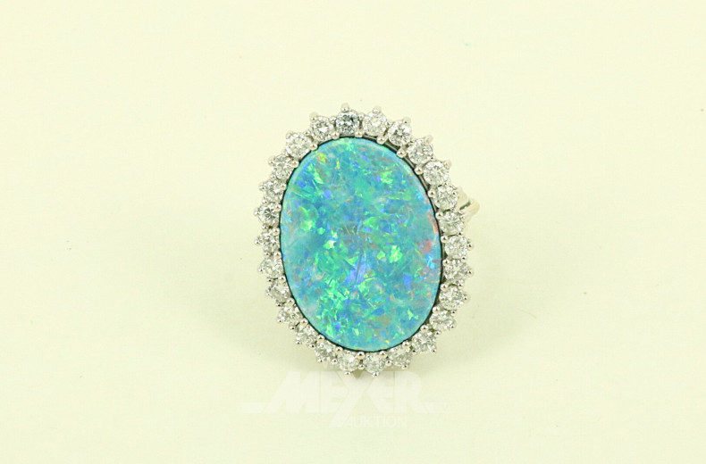 Damenring, besetzt mit 1 Opaldoublette sowie 26 nat. Diamanten im Brillantschliff von zus.ca. 1,04ct. tw-w/vsi-si