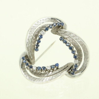 Kranzbrosche, 70er Jahre-Stil, mit kl. blauen Farbsteinen u. 4 kl. Besatz-Diamanten