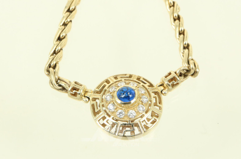 Collier mit dekorativem Anhänger, mit blauem Glas-Cabochon u. 10 farblosen Steinen