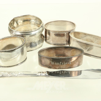 5 versch. Serviettenringe dt. Hersteller u. 1 engl. Buttermesser, 800er bis 925er Silber