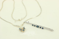 2 Teile Silberschmuck in 925er Silber, best. aus 1 Brosche u. 1 Collier mit kl. Saphiren