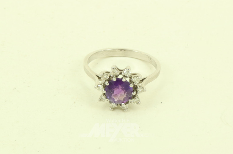 Ring mit lilafarbenem Farbstein u. 12 kl. Diamanten