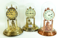 3 Jahresuhren, je mit Glassturz,
