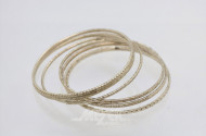 7 Armreifen, Silber, ca. 43 g.