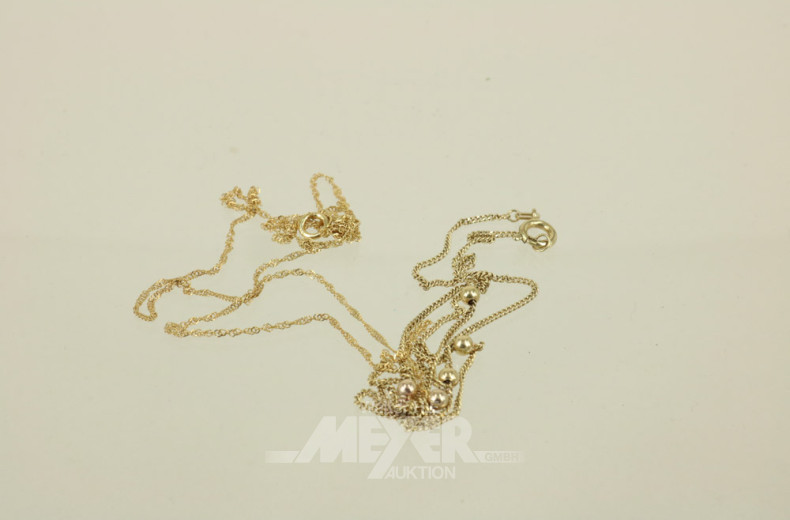 2 dünne Kettchen, 333er GG, ca. 2 g.